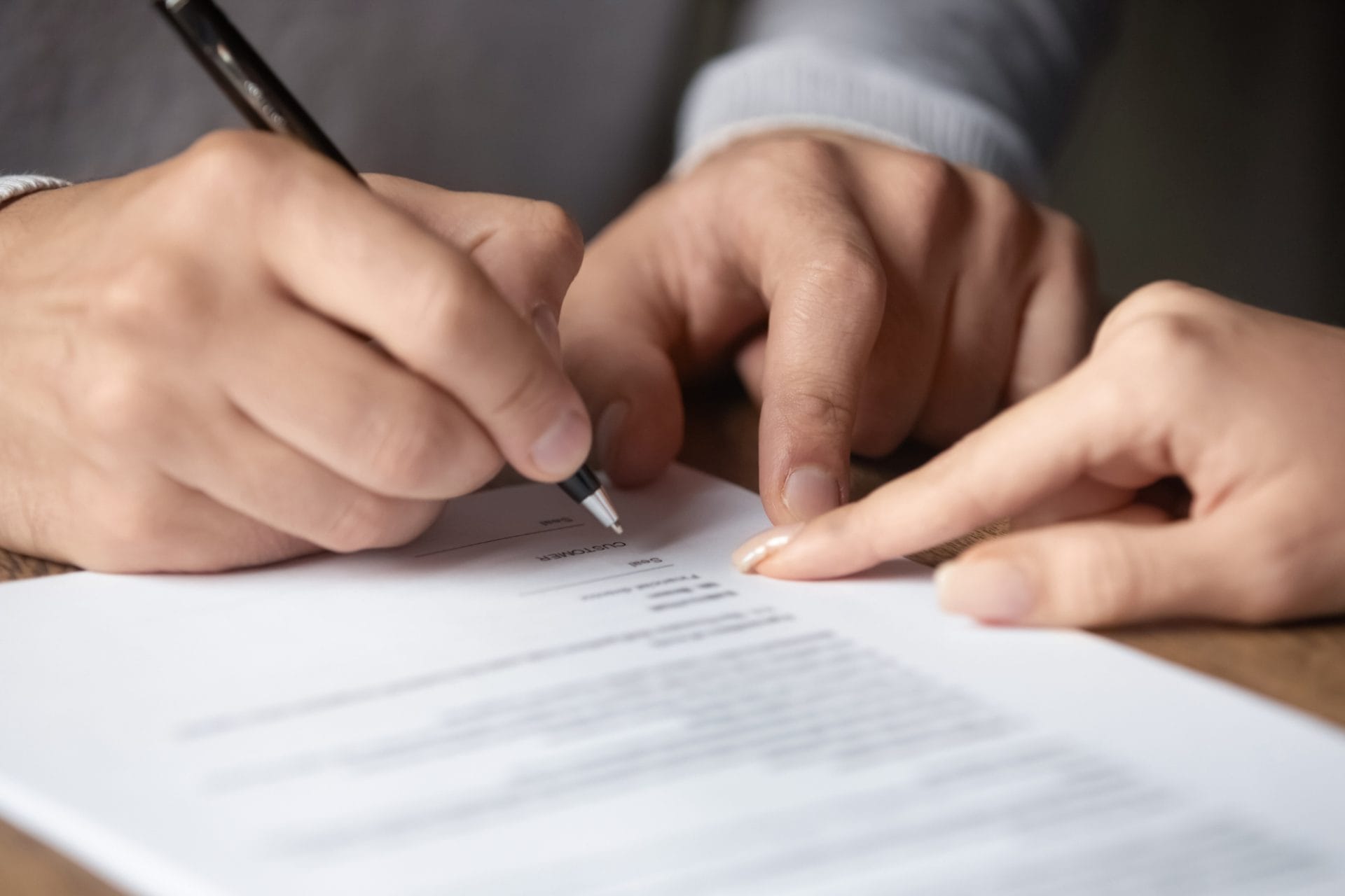 Solicitor assisting with document signing